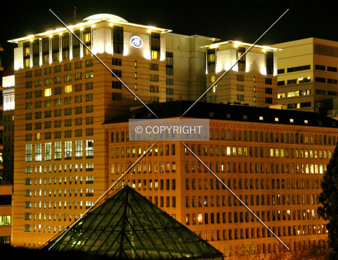 Looking at the top of the building at night