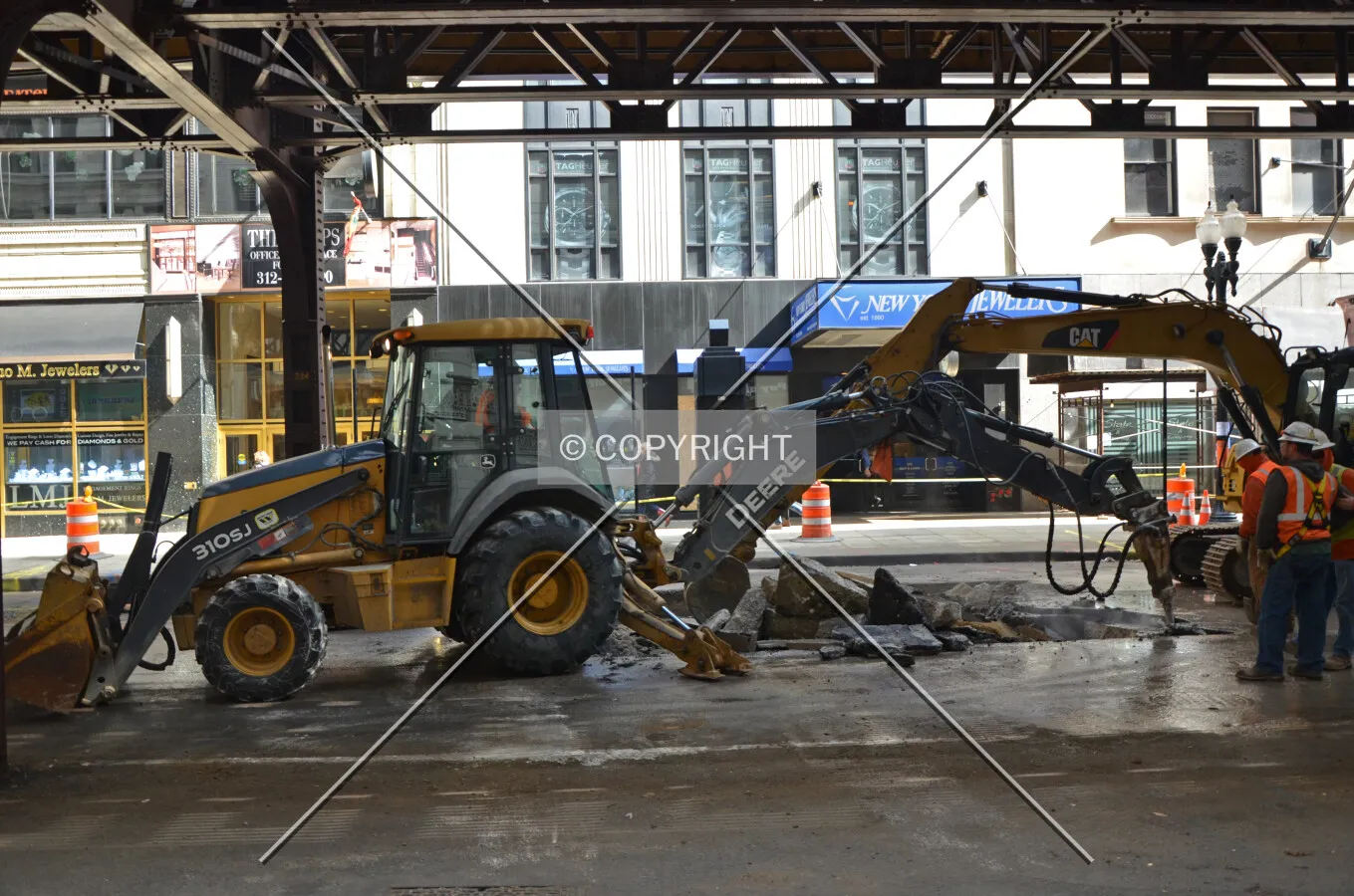 Workers performing utility work in Wabash Avenue in preparation for the station's demolition; March 10, 2015.