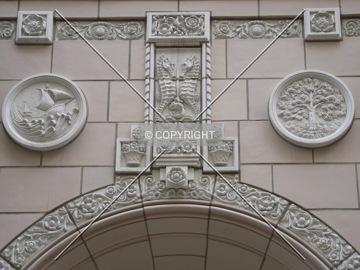 Onimental detailing above the archway of one of the restored facades