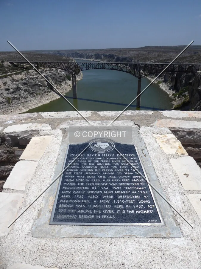 Historic plaque and full span from an overlook to the south