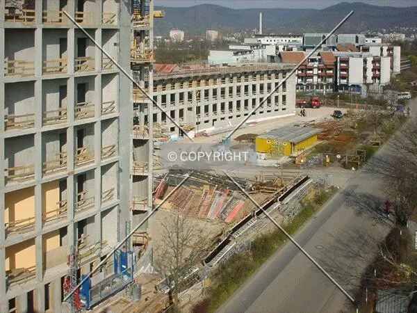 View over the site; left: the tower; center: low-rise wing