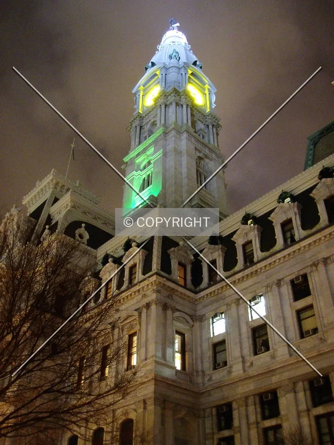 The tower is illuminated in green for St. Patrick's Day