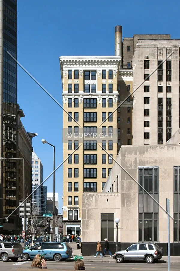 View to the northwest along St. Peter Street, past a low-rise section of City Hall