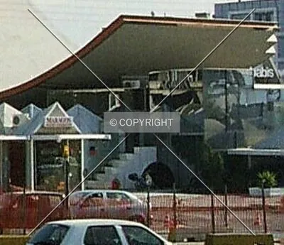 Displaying the curved roof it shares with Agora Center 3