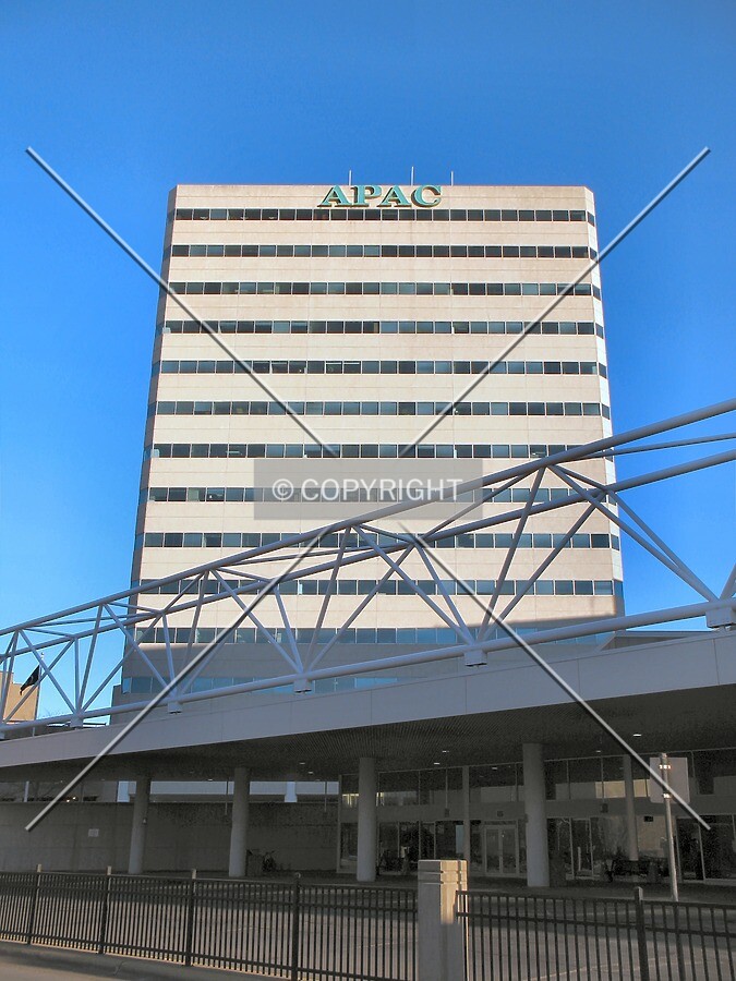 Looking up the west facade, rising above the Transit Center canopy