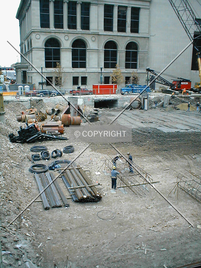 Construction workers wrapping re-bar for caissons