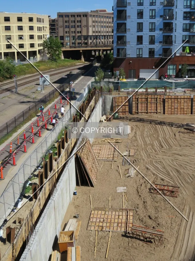 Northwest foundation wall next to bike trails