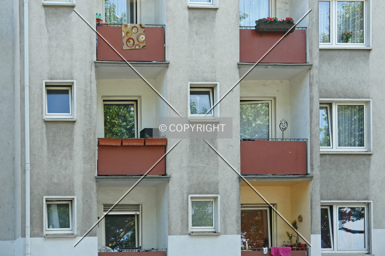 A residential building with very tiny balconies