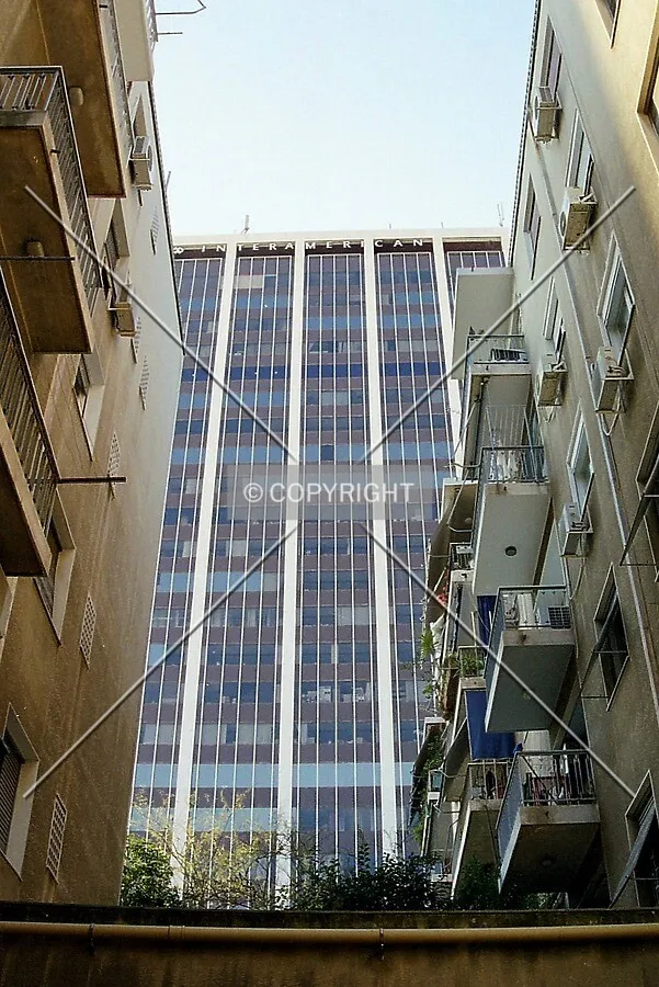 Unusual view of the building from a spot between two neighbouring lowrise residentials