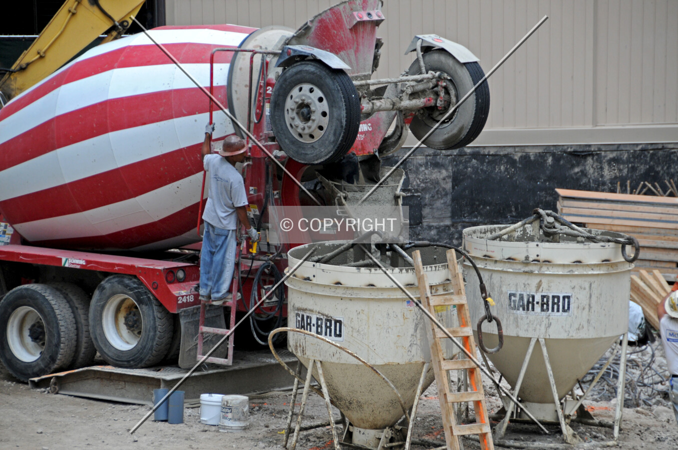 Pouring concrete into a bucket for hoisting