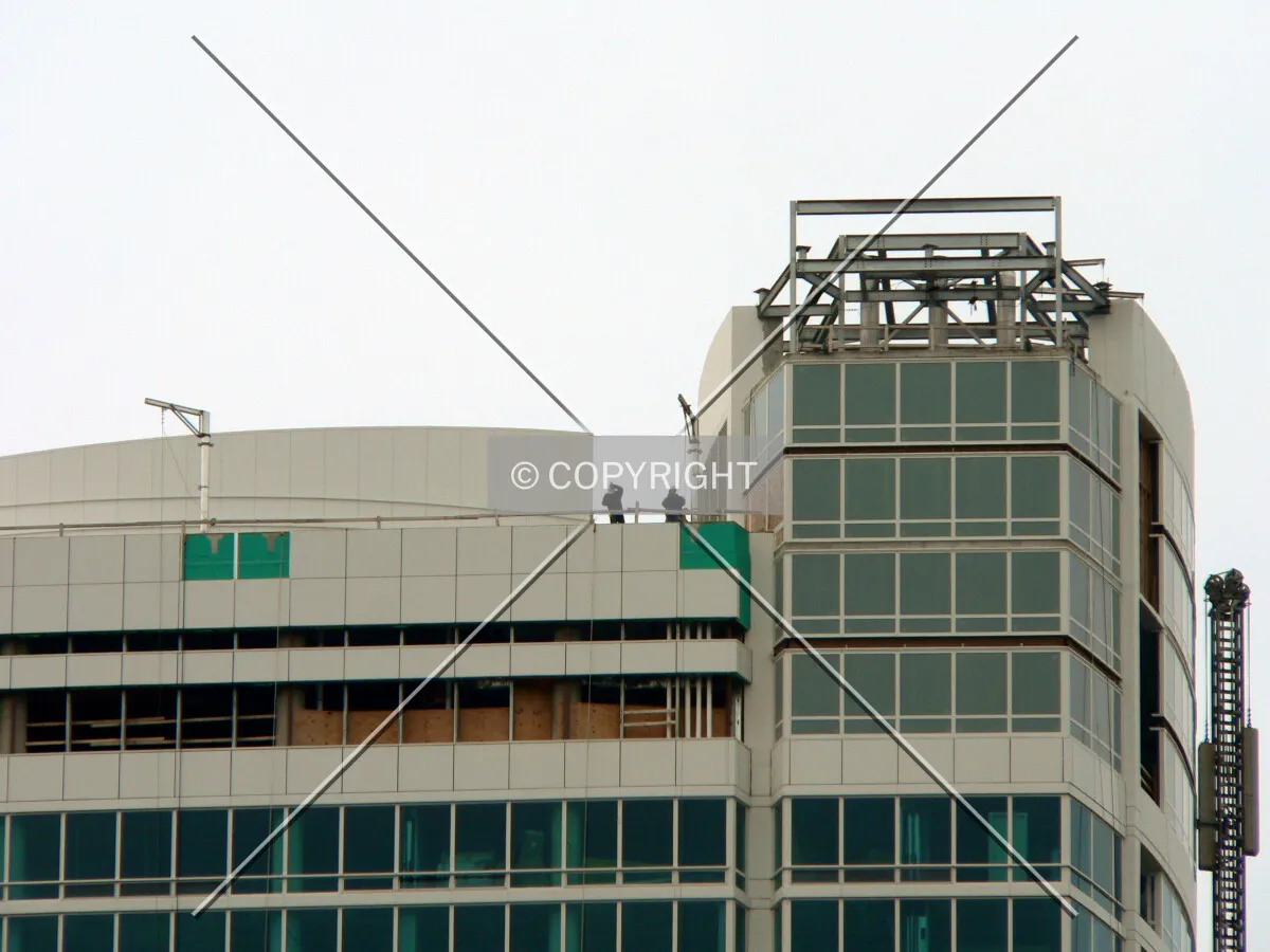Construction workers on the roof as seen from New Street