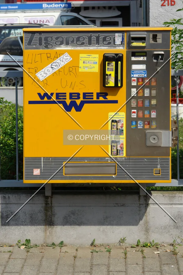A yellow cigarette automat