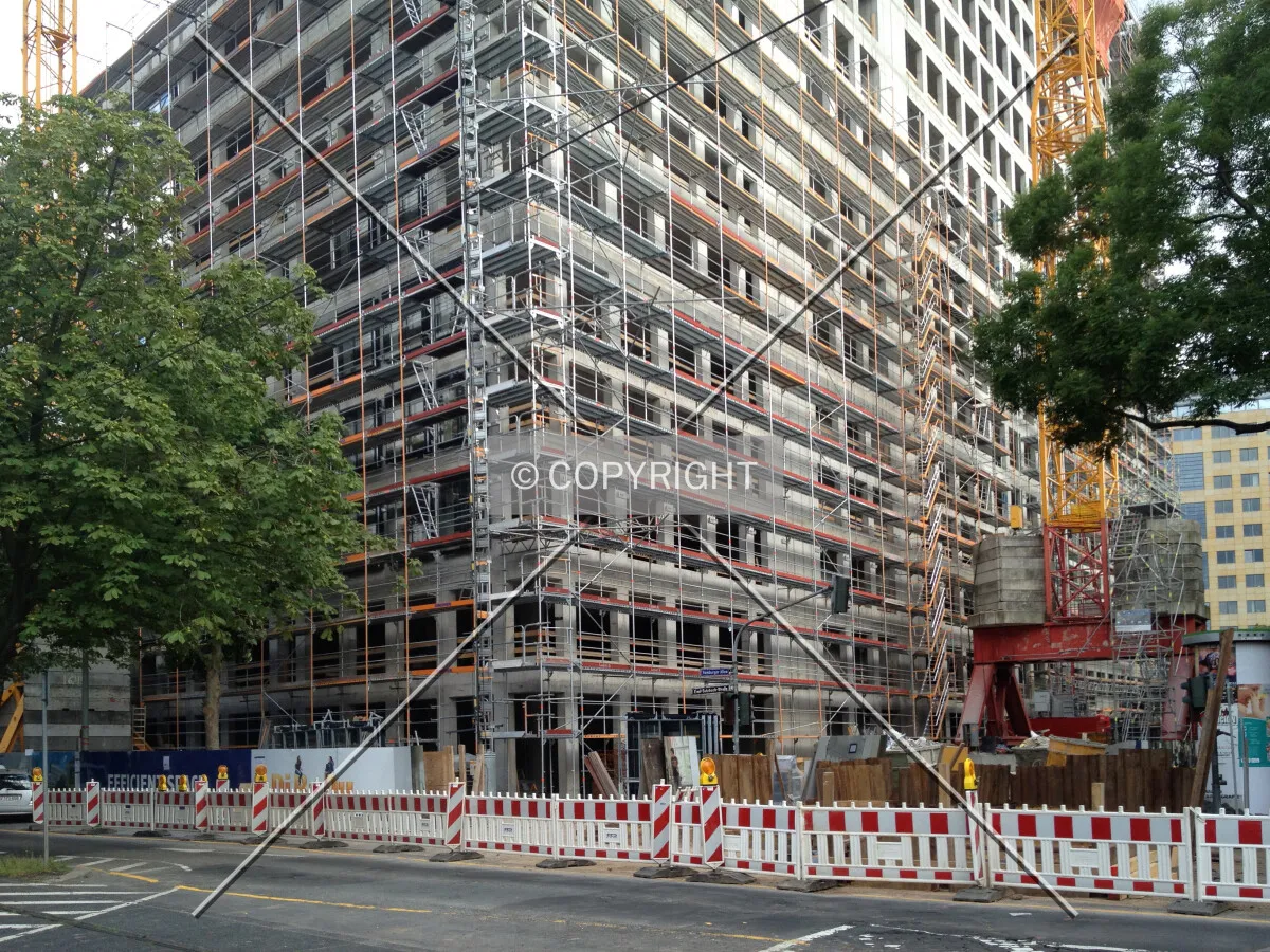 Scaffolding in front of the concrete shell