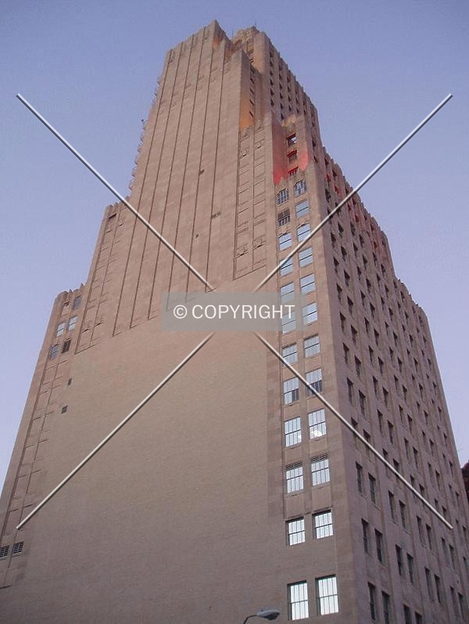 The windowless side from below at twilight