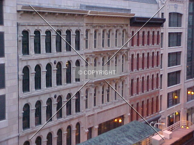 The restored facades of 4 buildings as viewed from the 5th level of a parking garage at Randolph and Wabash Streets