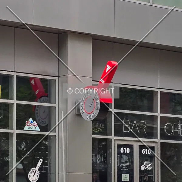 A pizza cutter sign on the north facade, Wednesday, October 14, 2026