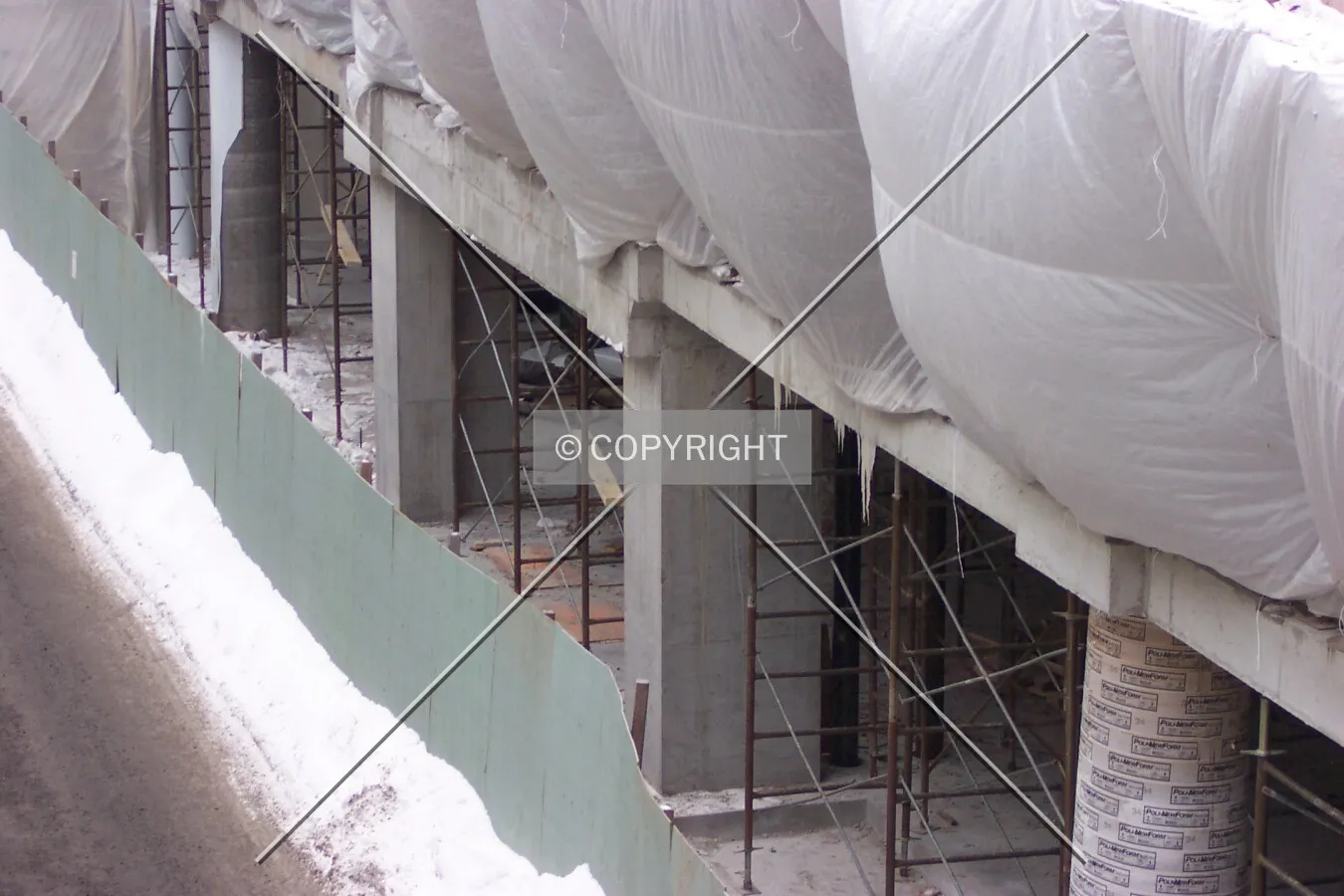 Looking down at the alley between the two buildings, on the east side of the site