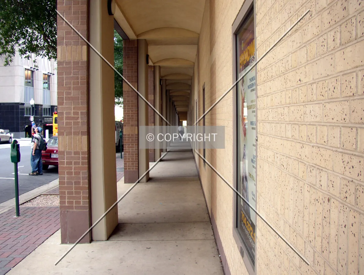 Sidewalk along East 5th Street at the tower’s base