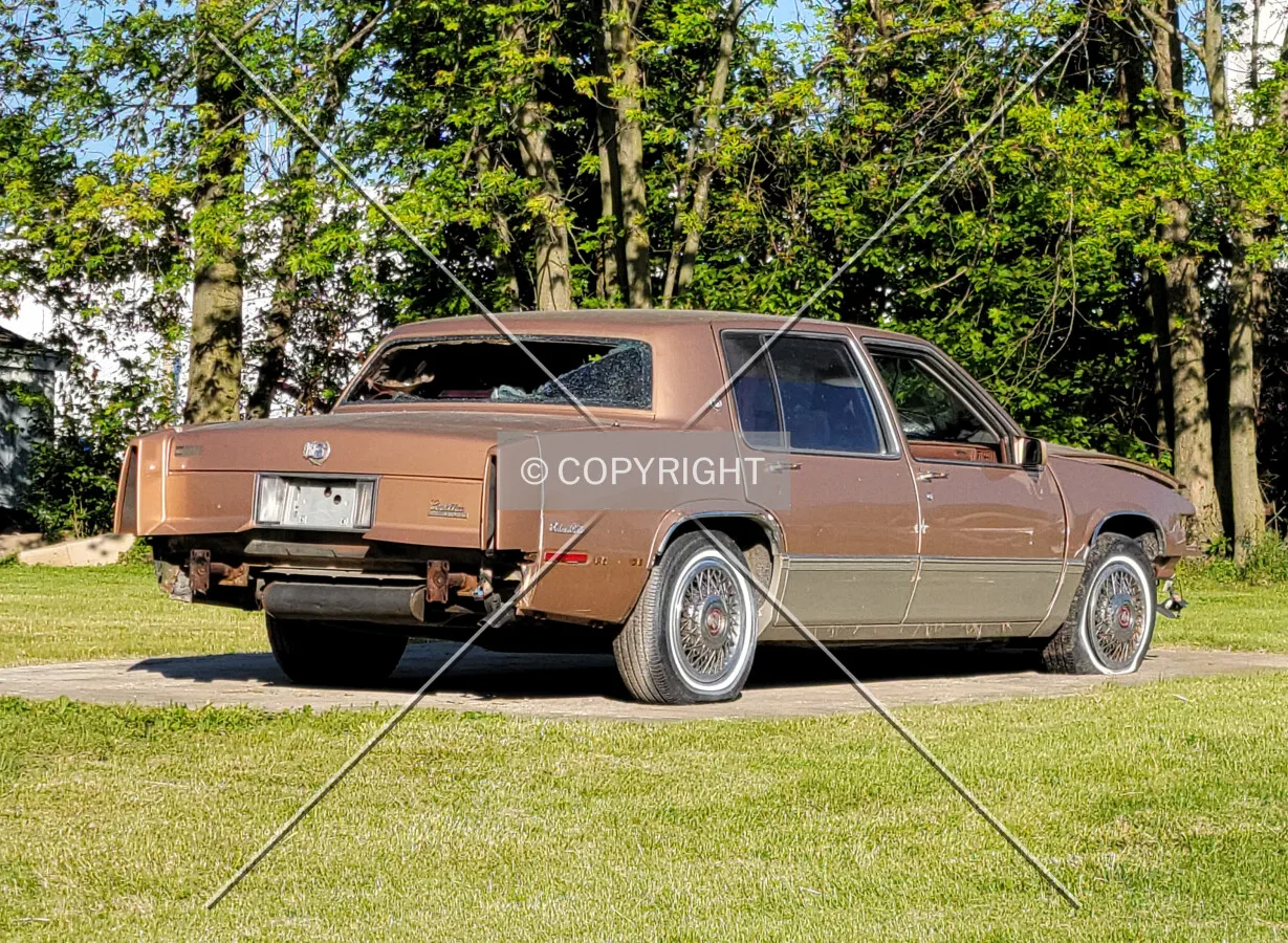 A broken down Cadillac Deville parked in Raymond, Illinois