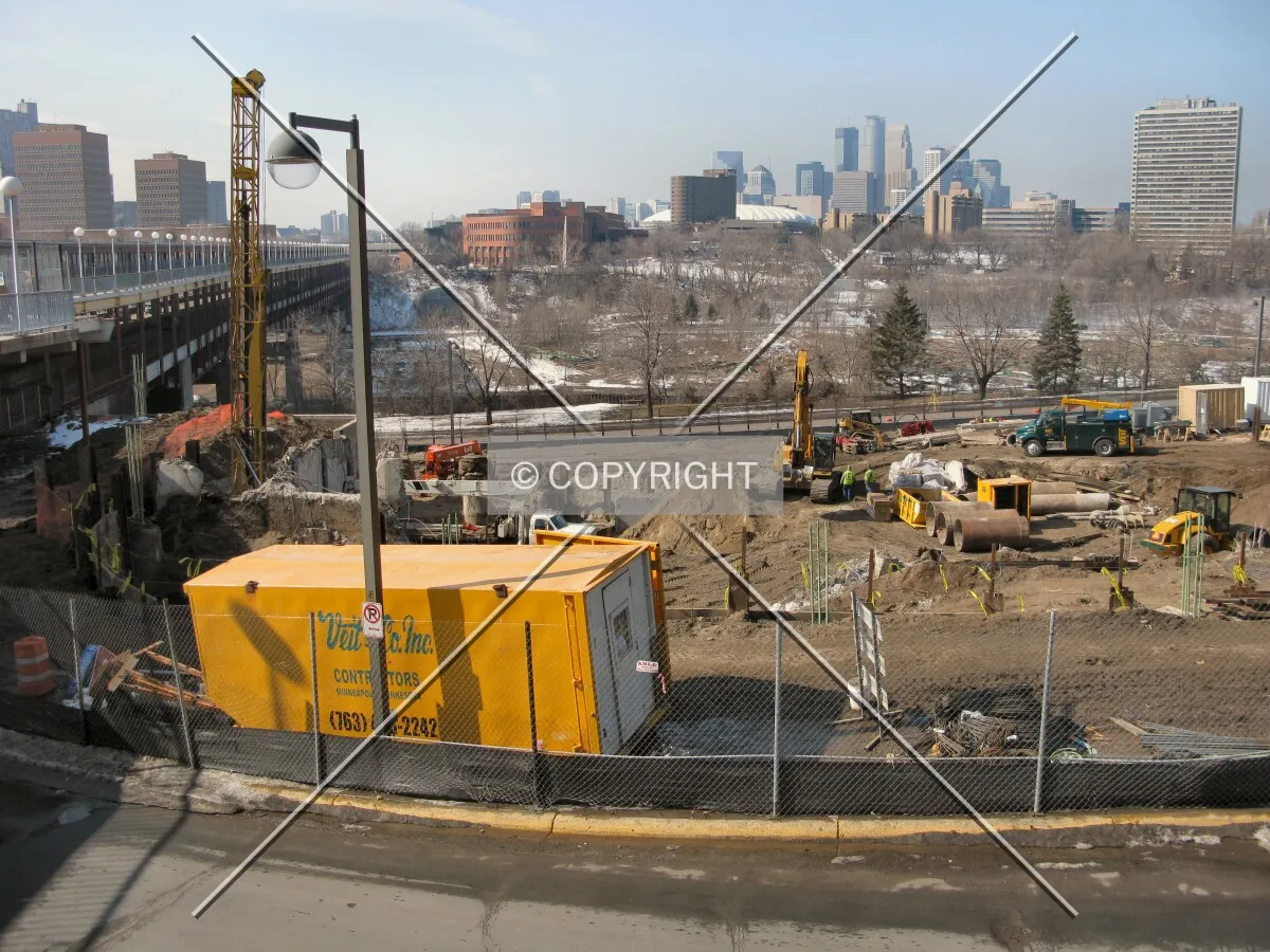 View to the west from Pleasant Street SE, with the Washington Avenue Bridge over the Mississippi River; Downtown Minneapolis in the distance