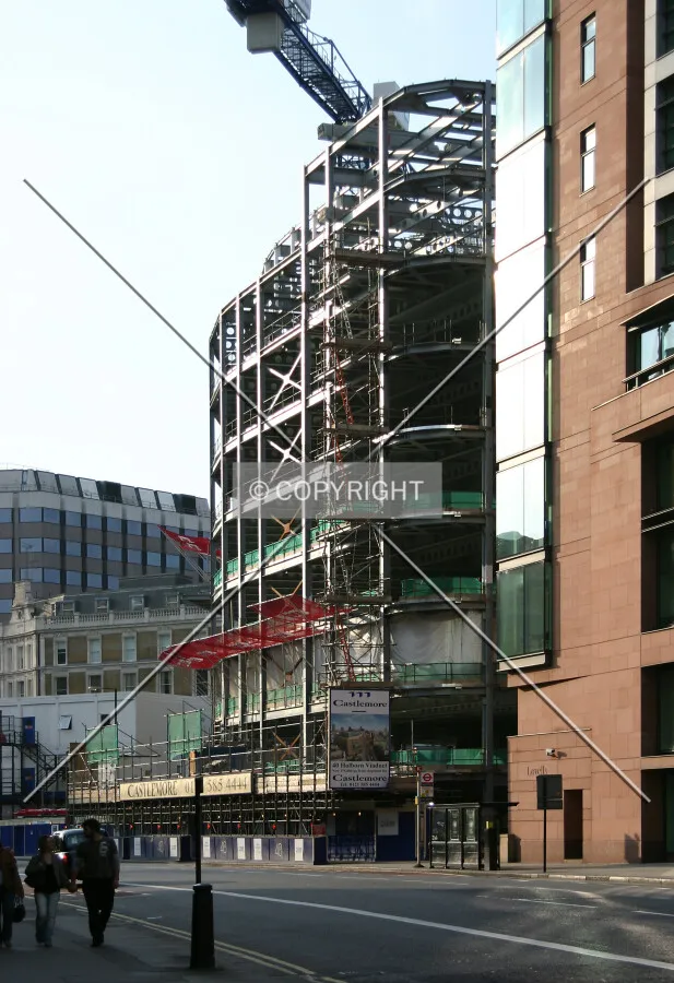 View west along Holborn Viaduct of the steel frame glinting in the evening sun