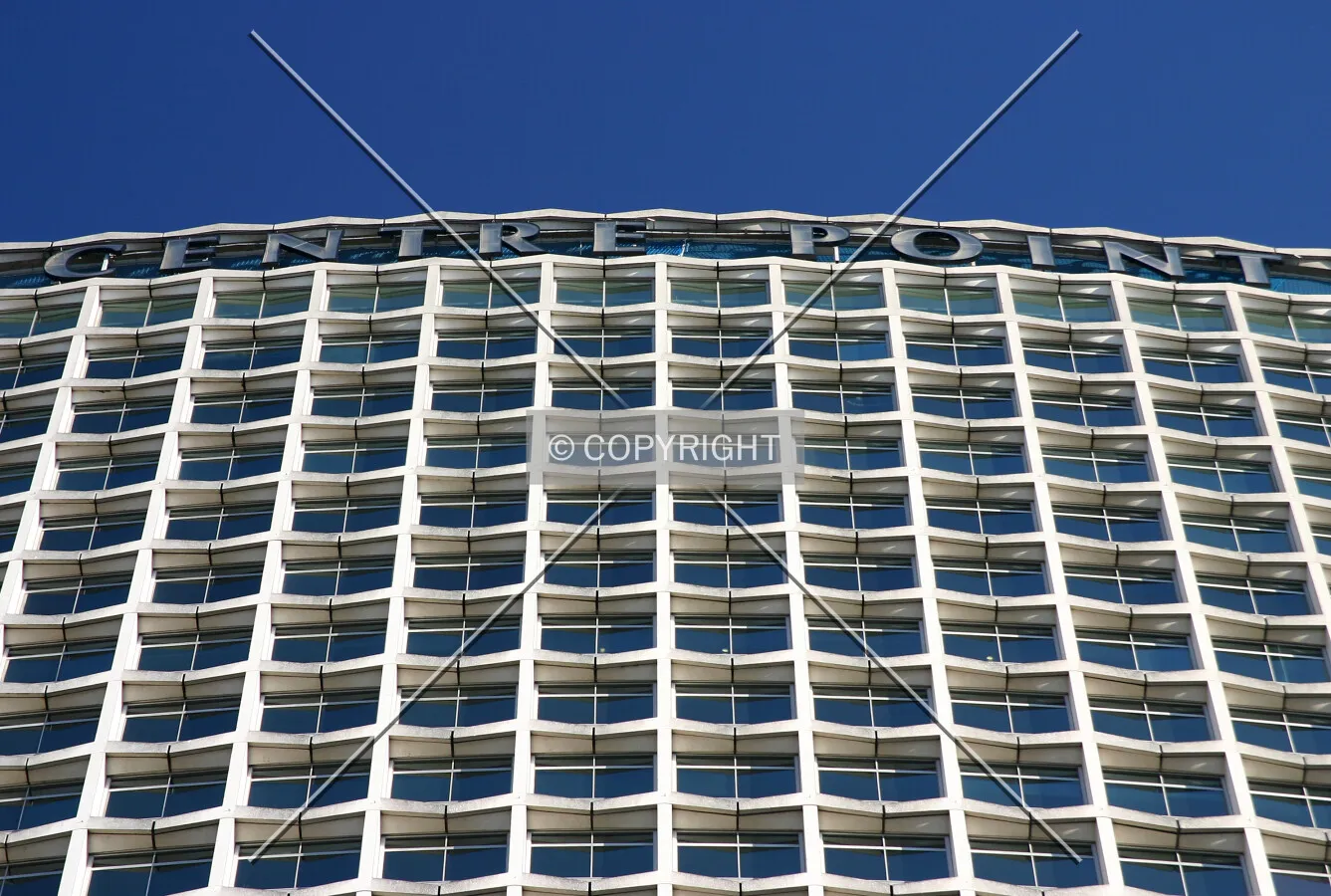 Looking up to the signage atop the west side from Charing Cross Road