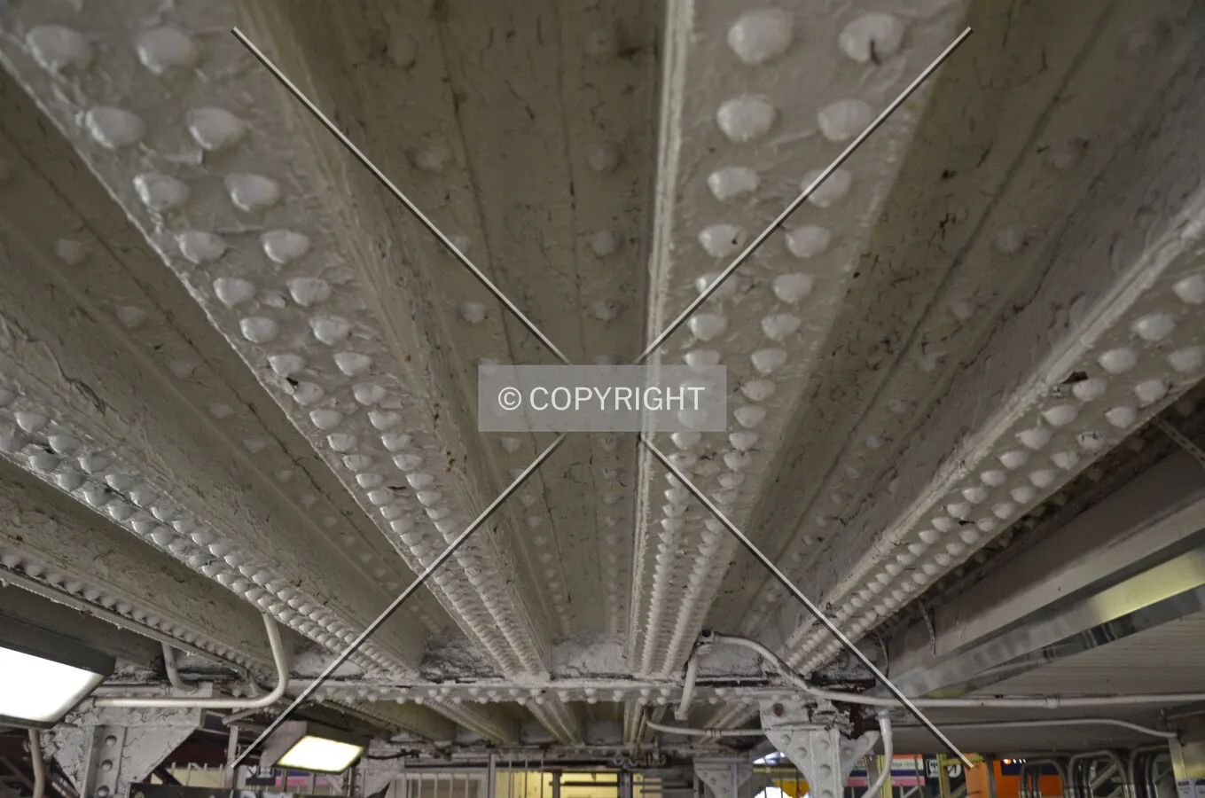 Detail of riveted steel connections for the underside of the track structure forming a ceiling for the mezzanine level; March 7, 2015.