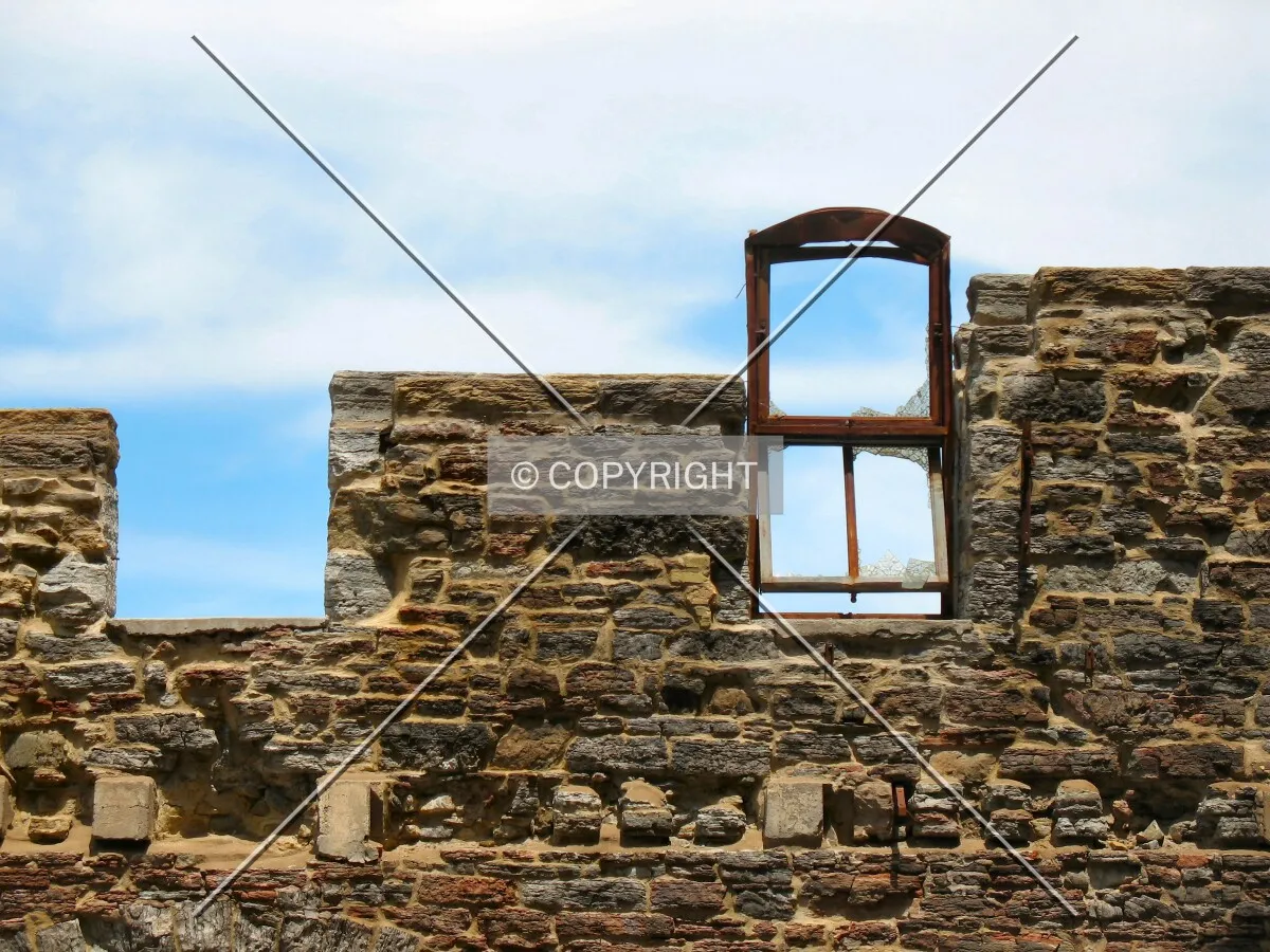 Original window perched on the north-facing ruin wall