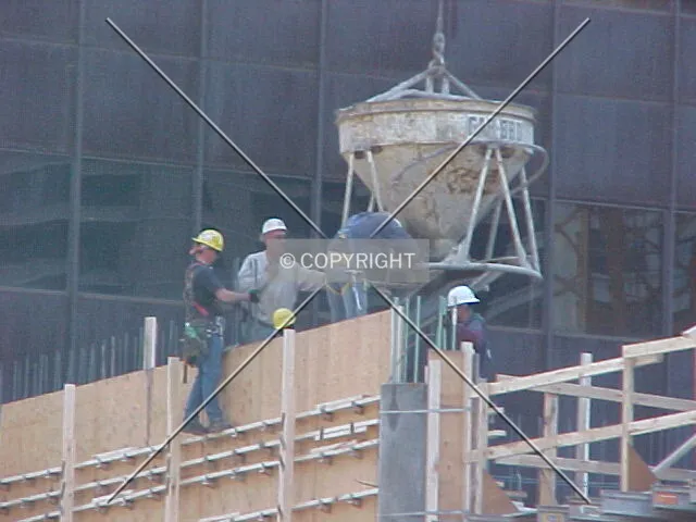 Pouring concrete into formwork that is forming the parking structure