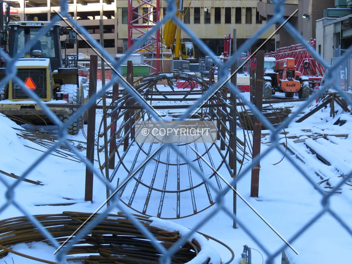 Through the construction fence along Marquette Avenue
