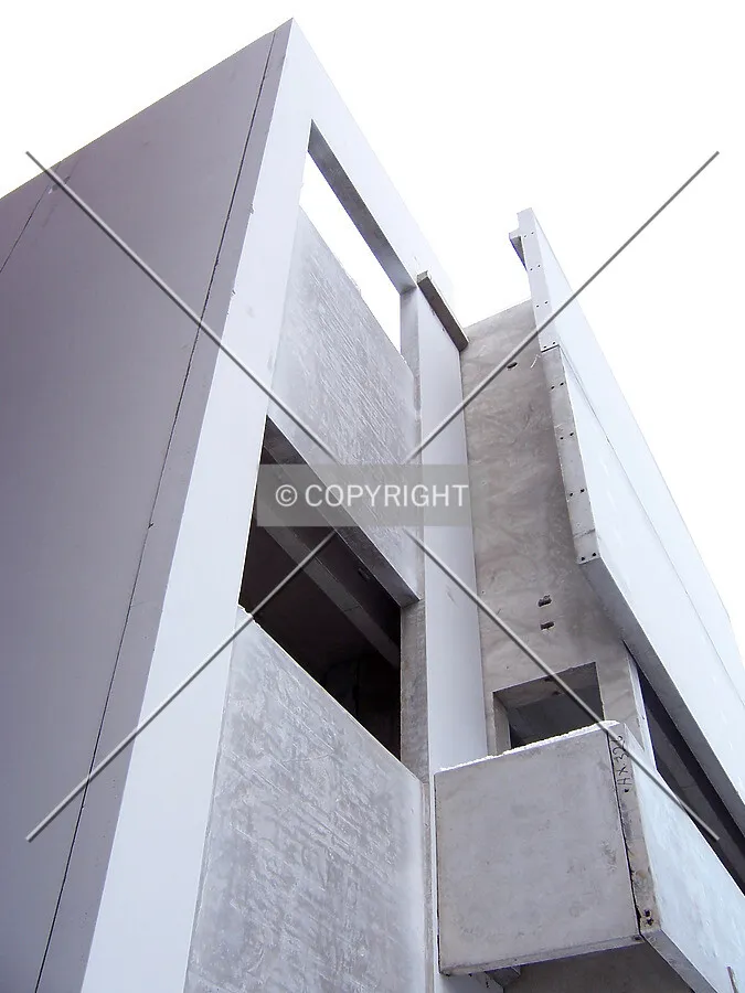 Assembly of pre-cast concrete panels on the southwest corner of the building’s base