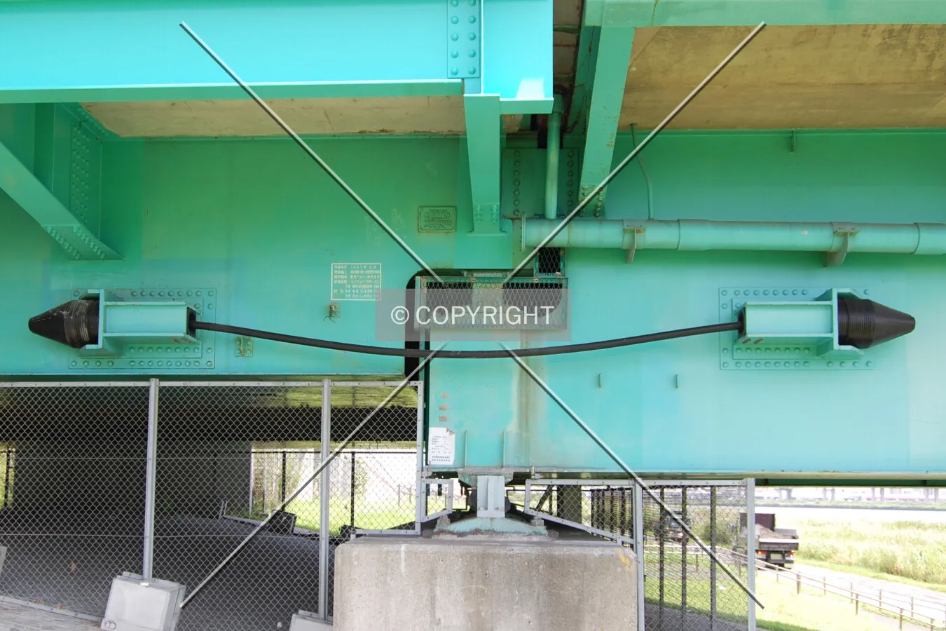 Unseating-prevention cable at the west end