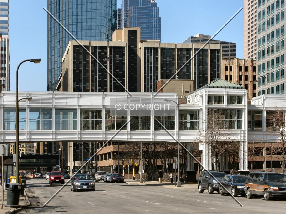 Distant view to the west along 8th Street South, past one of many skyways