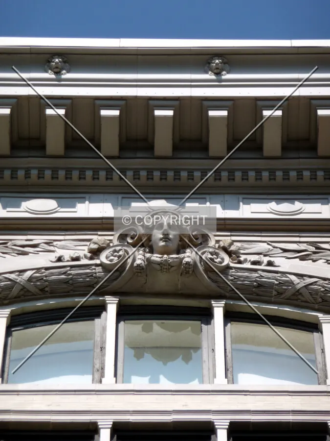 Cornice and sculpture on the south facade