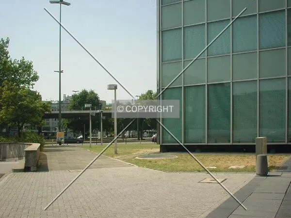 Footpath between car park entrance (left) and the tower (right)