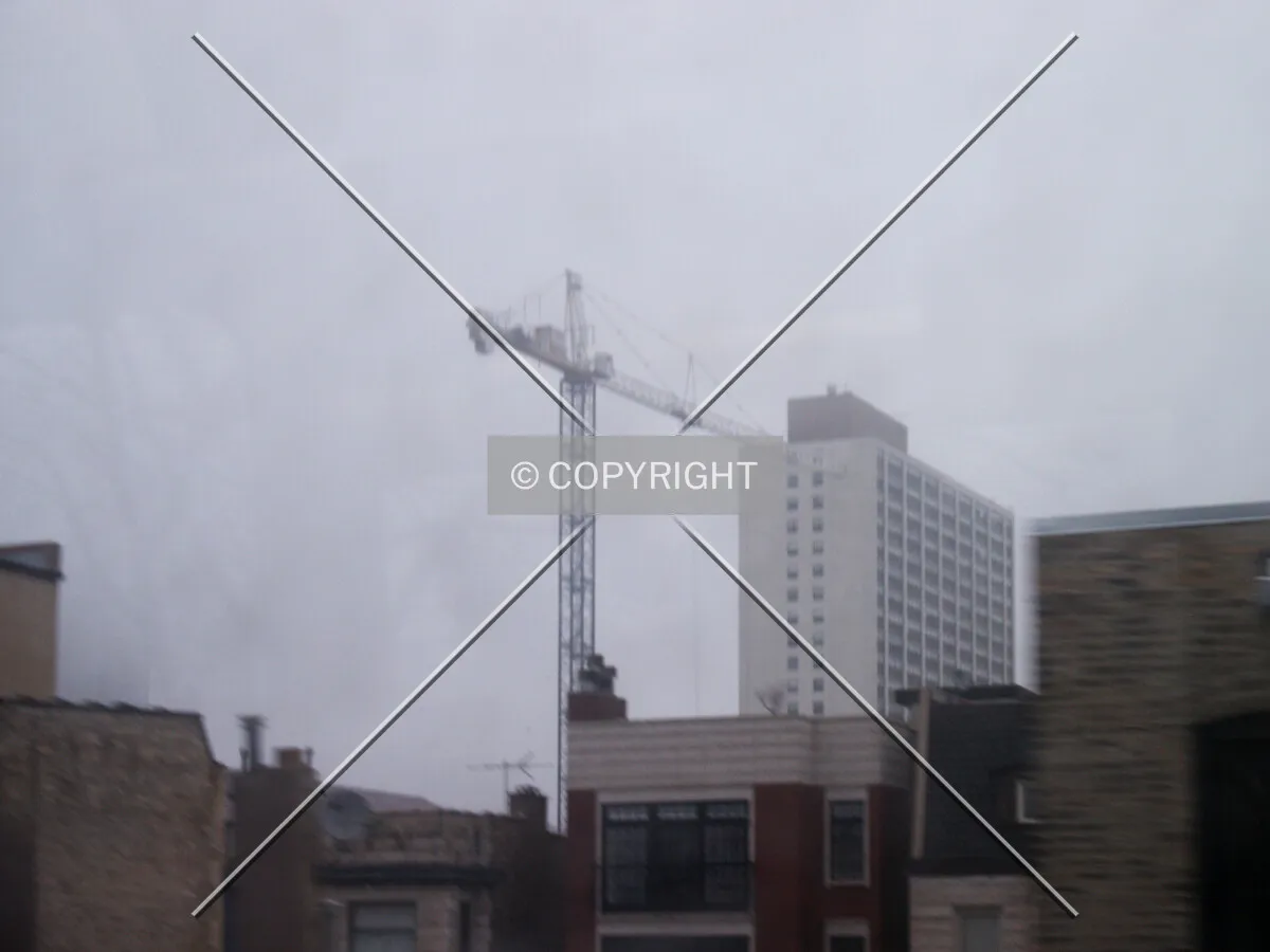 Tower crane seen from a passing el train