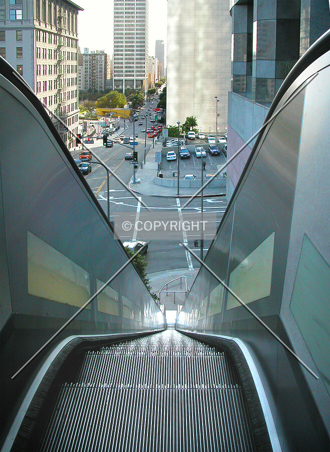 Top of escalator which rises about 40 feet in elevation from the corner of 4th & Grand