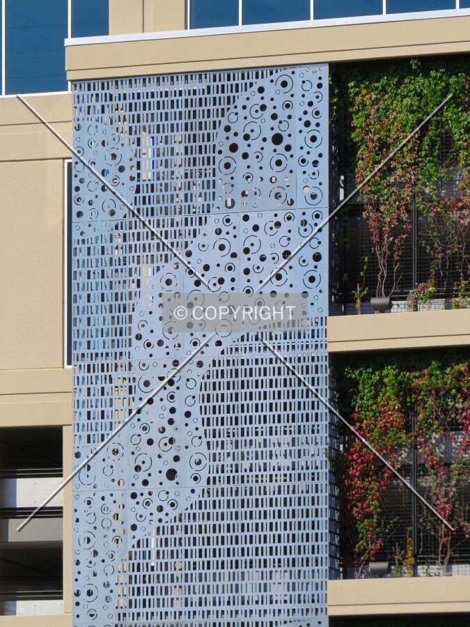 Metal and plant screening for the parking levels