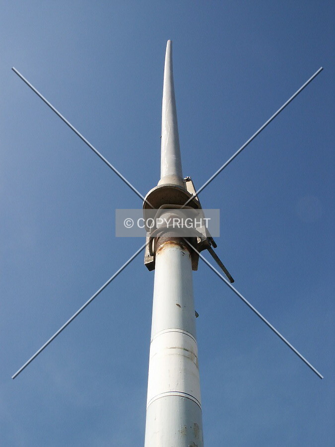 The highest point on the building, an antenna near the southeast corner