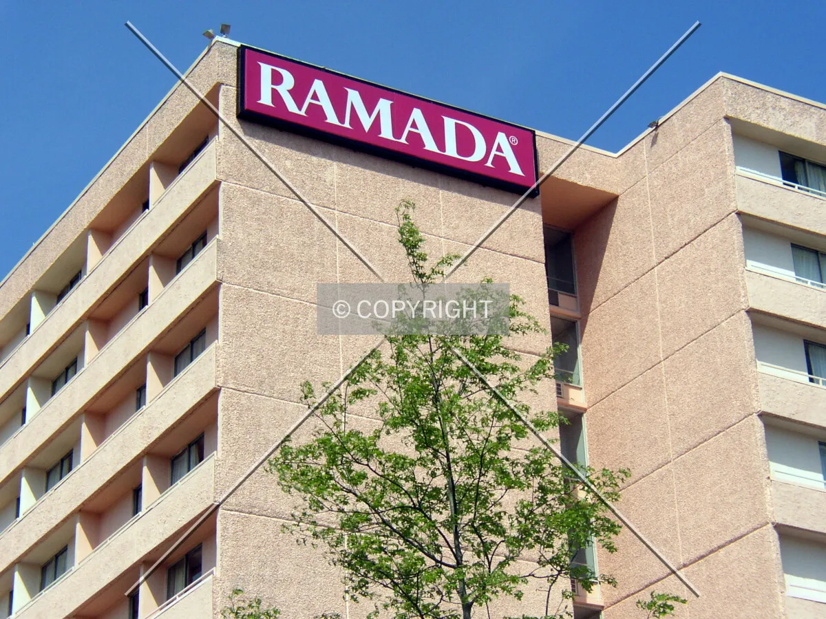 Signage and the upper floors on the southeast corner