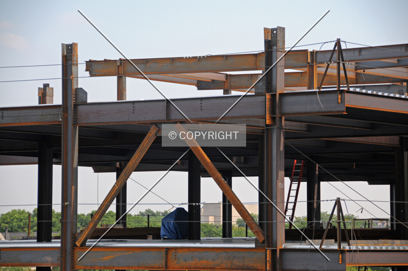 Steel bracing within the skeletal structure of the low-rise addition