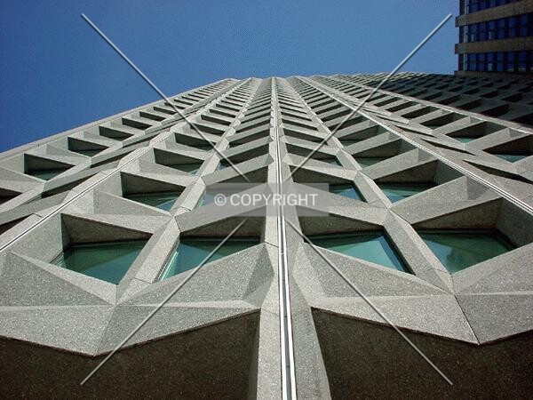 View to the top along the stone facade