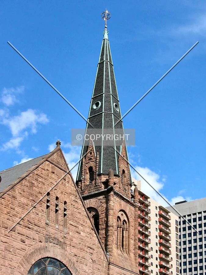 Churchtower rising with modern towers, from the northwest