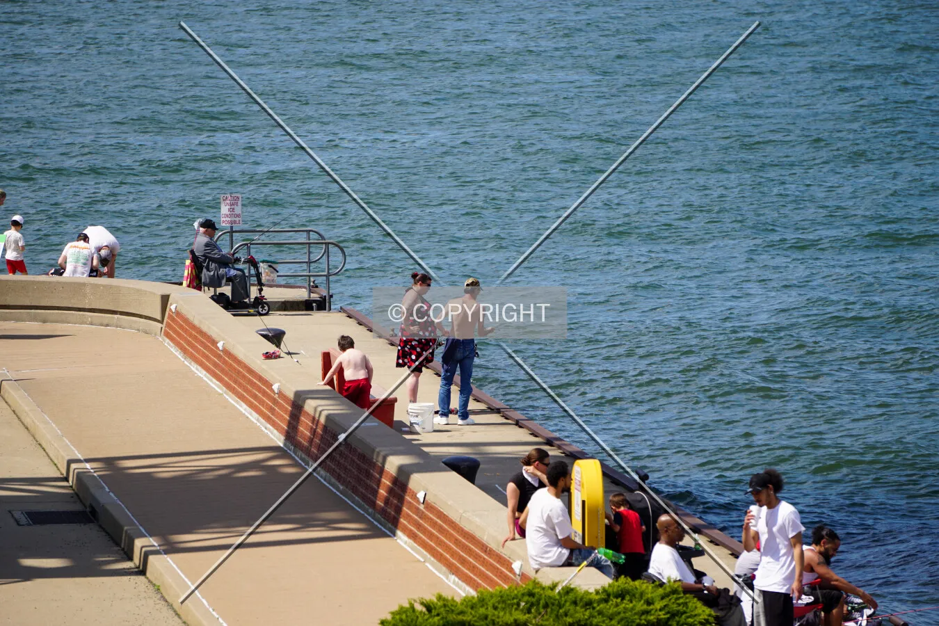 People fishing below the tower; May 24, 2020