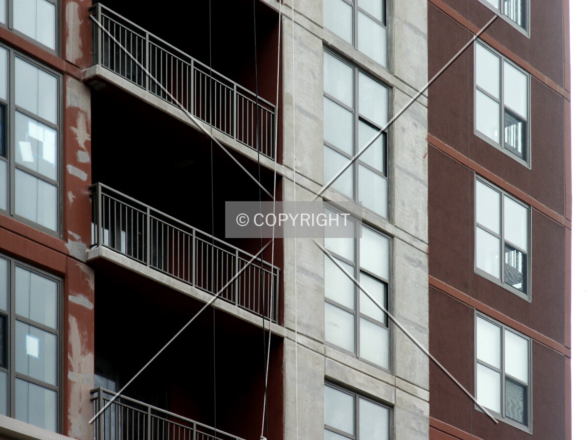 Detail of the unpainted strip on the north facade where the hoist was