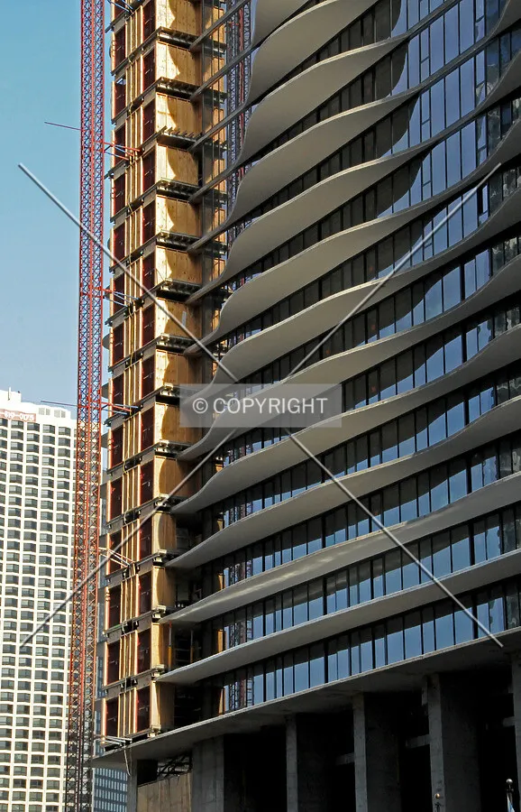 Construction skip and north facade viewed from the west