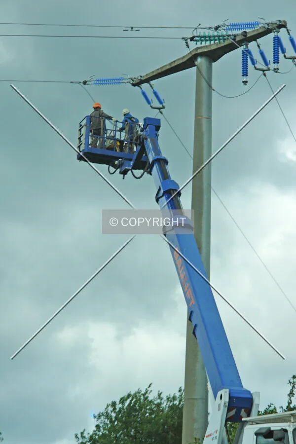 Two workers are reparing a high voltage power line - the many electricity networks are not stable enough anymore