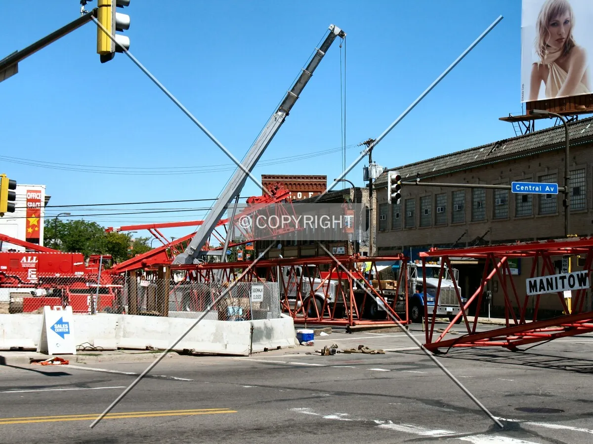 Dismantling the crane, from across Central Avenue SE