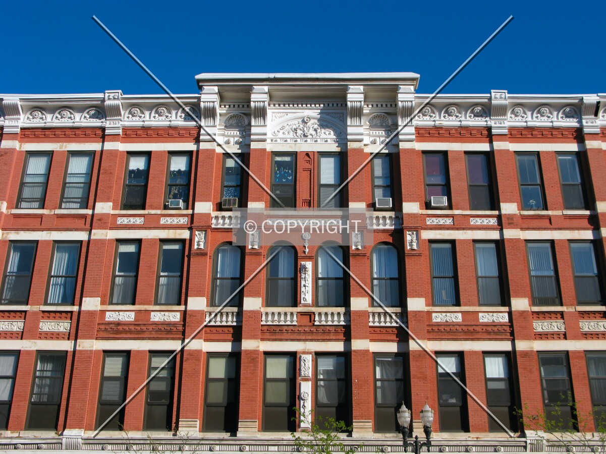 Facade detail from across East 7th Street