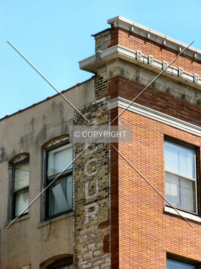 Fading advertisement atop the southwest corner